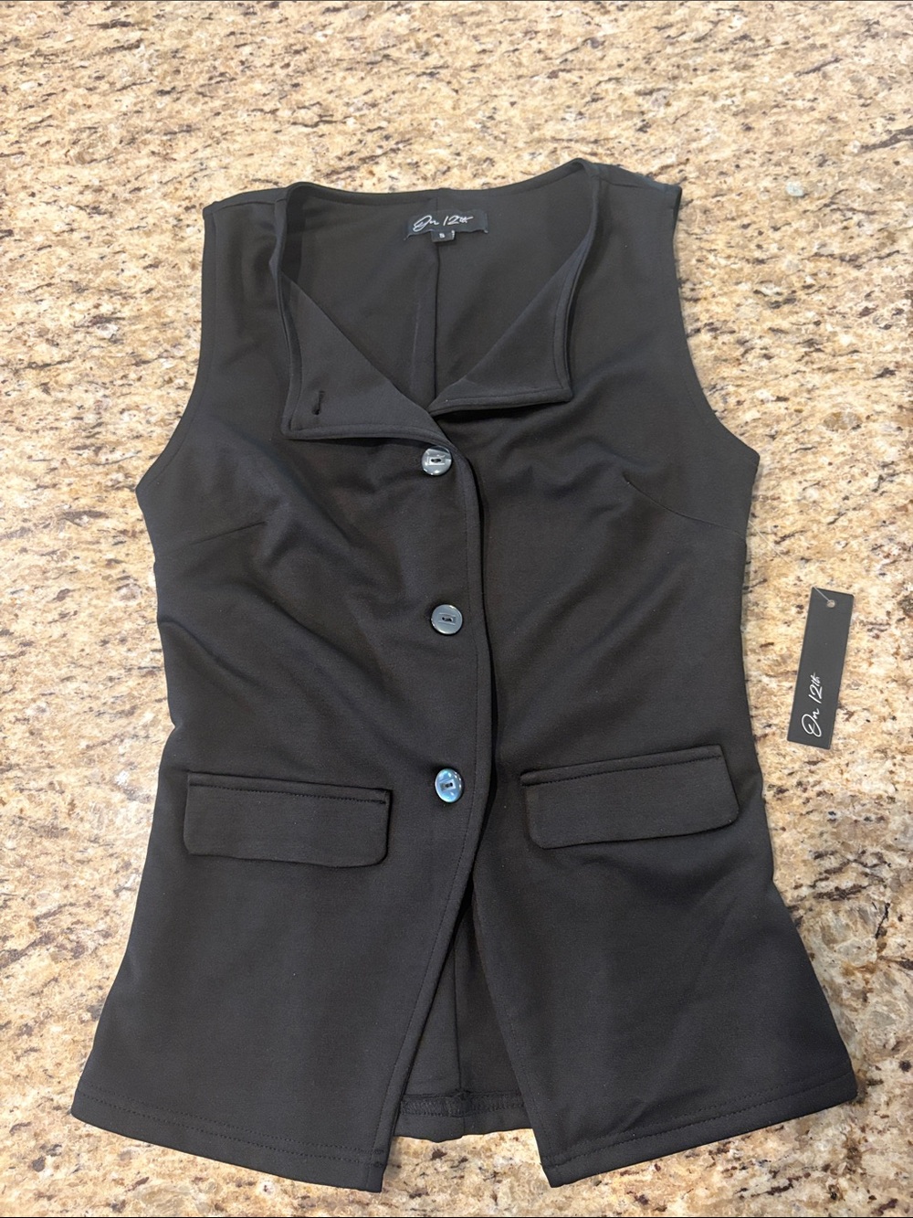 Black Sleeveless Button-Front Vest by On 12th